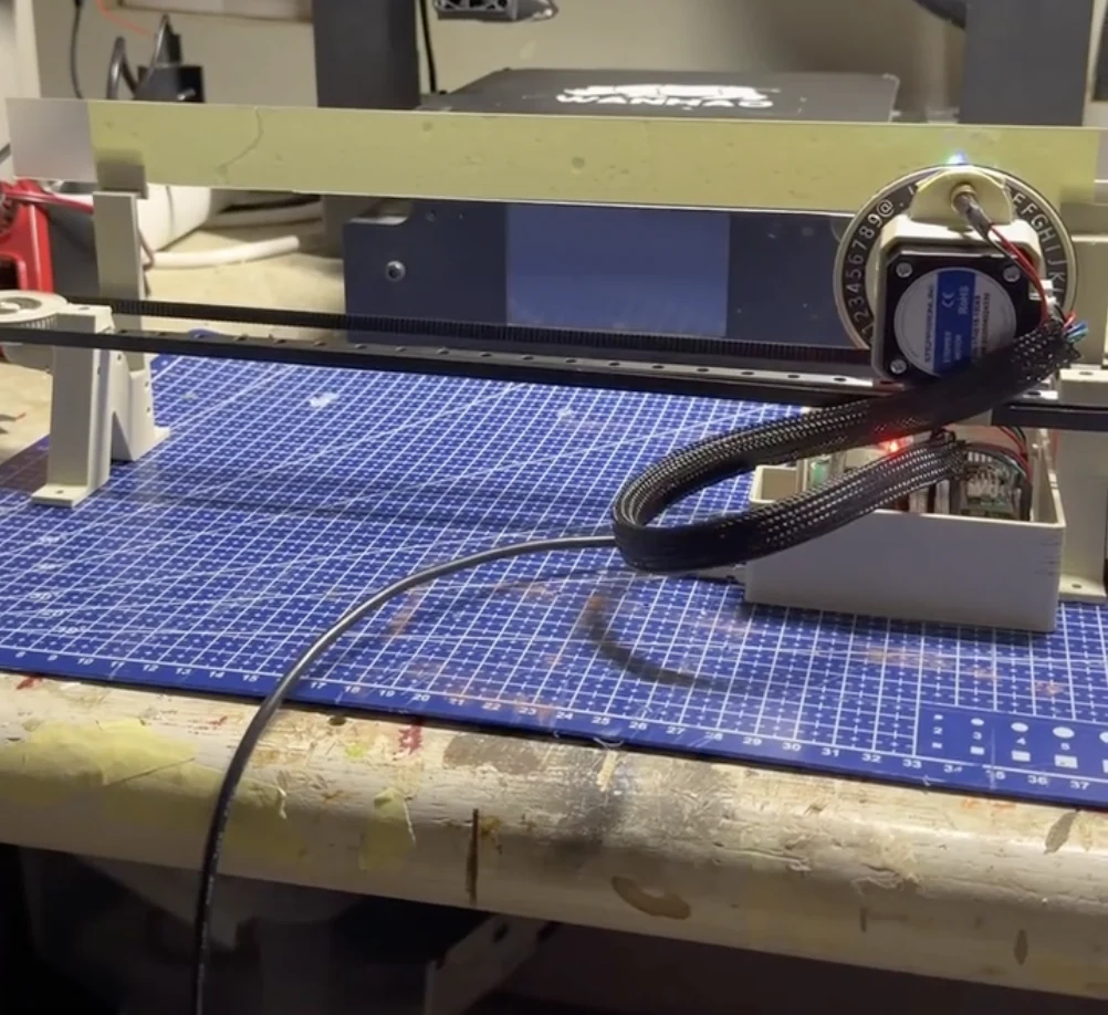 Glow printer prototype assembled on a blue cutting mat